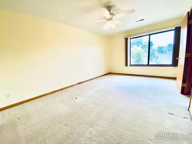 a bathroom with a sink a toilet and a large mirror