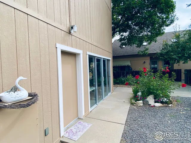 a living room filled with furniture and a potted plant