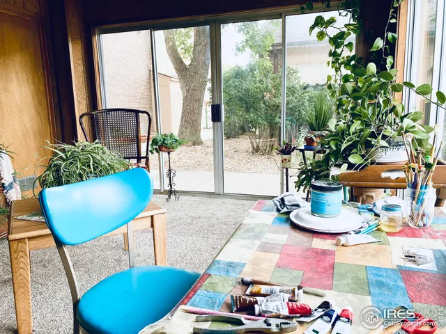 a living room filled with furniture and a chandelier