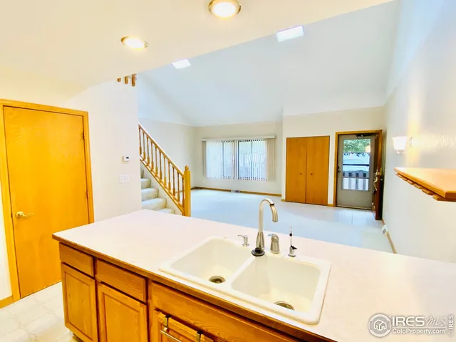 a bathroom with a sink and a large mirror