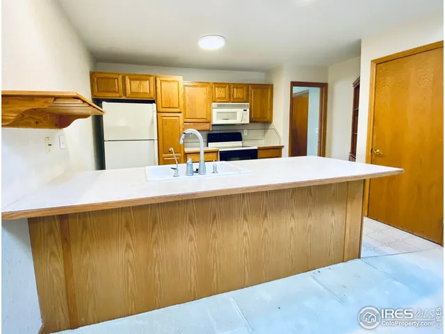 a room with a bed and a dresser