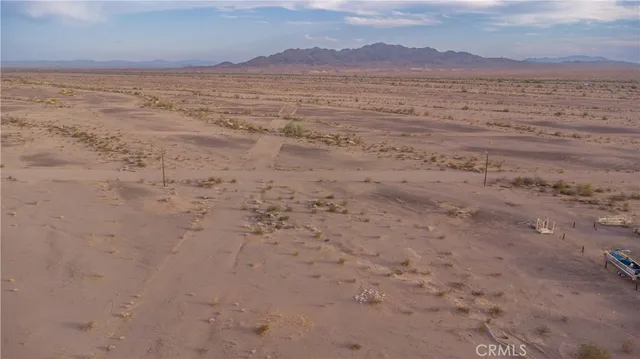 a view of an ocean beach and mountain