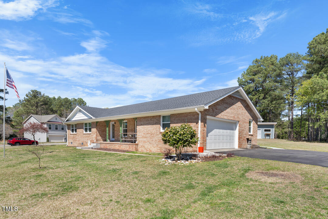 916 Clayton Road Durham, NC 27703 - Photo 23 of 32 a front view of a house with garden