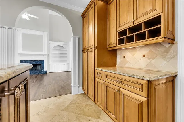 a bathroom with a granite countertop sink a toilet and a mirror