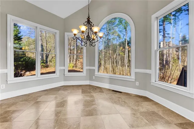 a kitchen with granite countertop a refrigerator and a sink