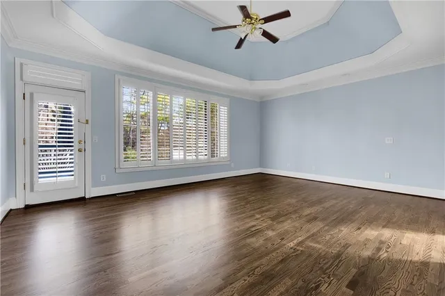 a kitchen with granite countertop wood cabinets stainless steel appliances and a sink