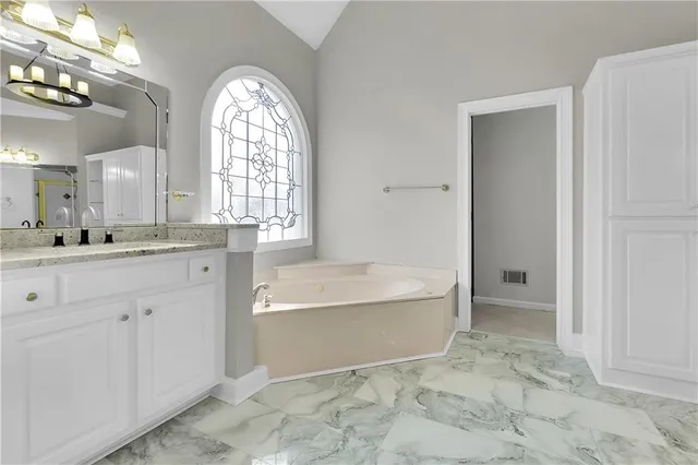 an aerial view of a house with garden space and street view