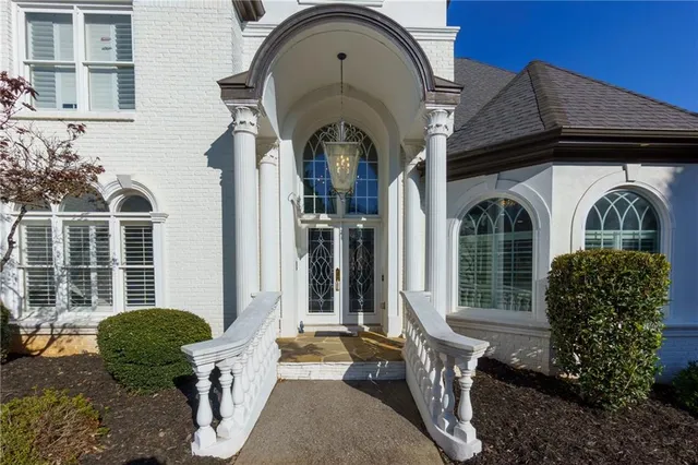 a front view of a house with garden