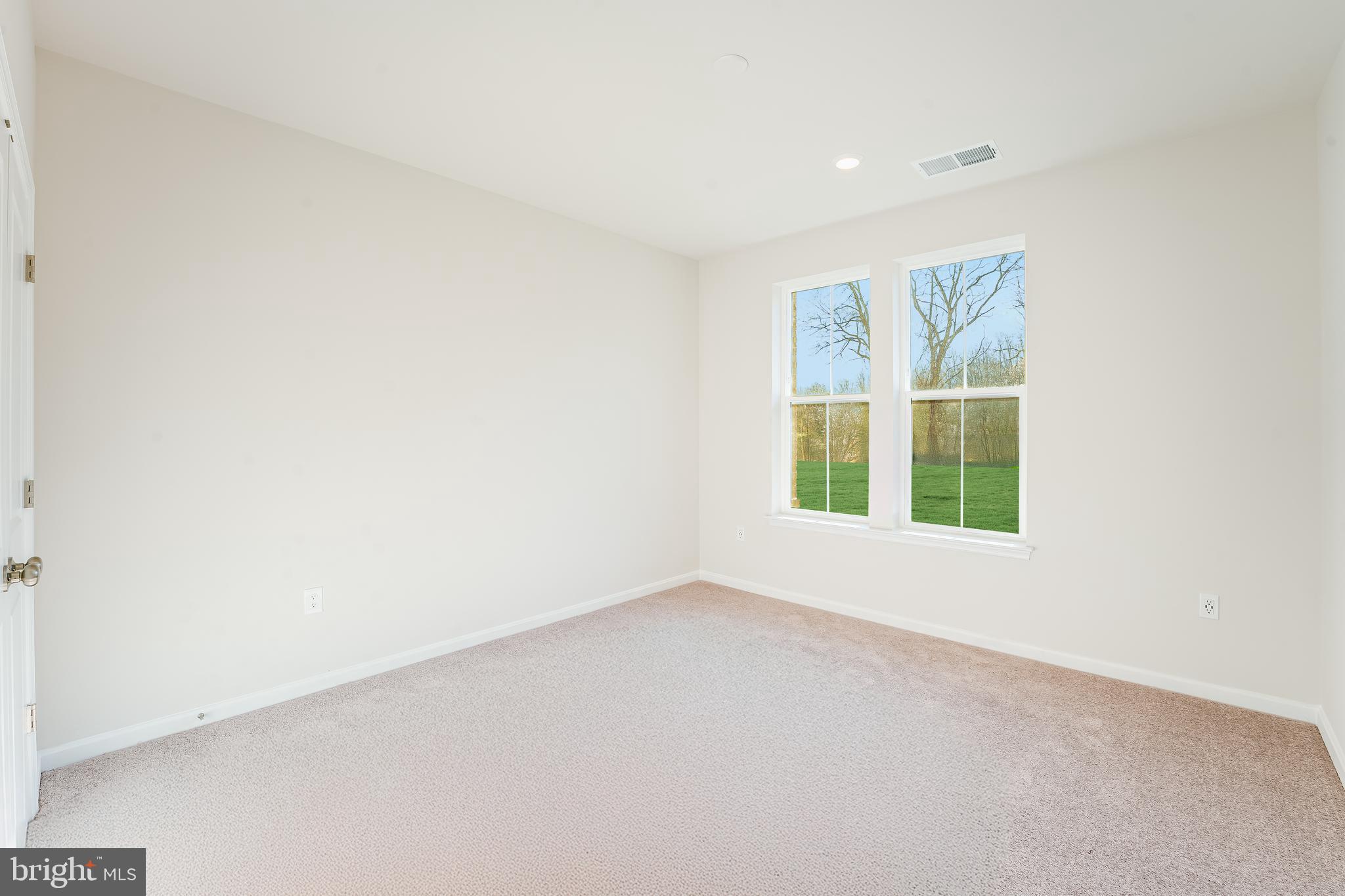 4003 Seaside Alder Road, Unit 102 ASTER Bowie, MD 20720 - Photo 11 of 16 an empty room with a window
