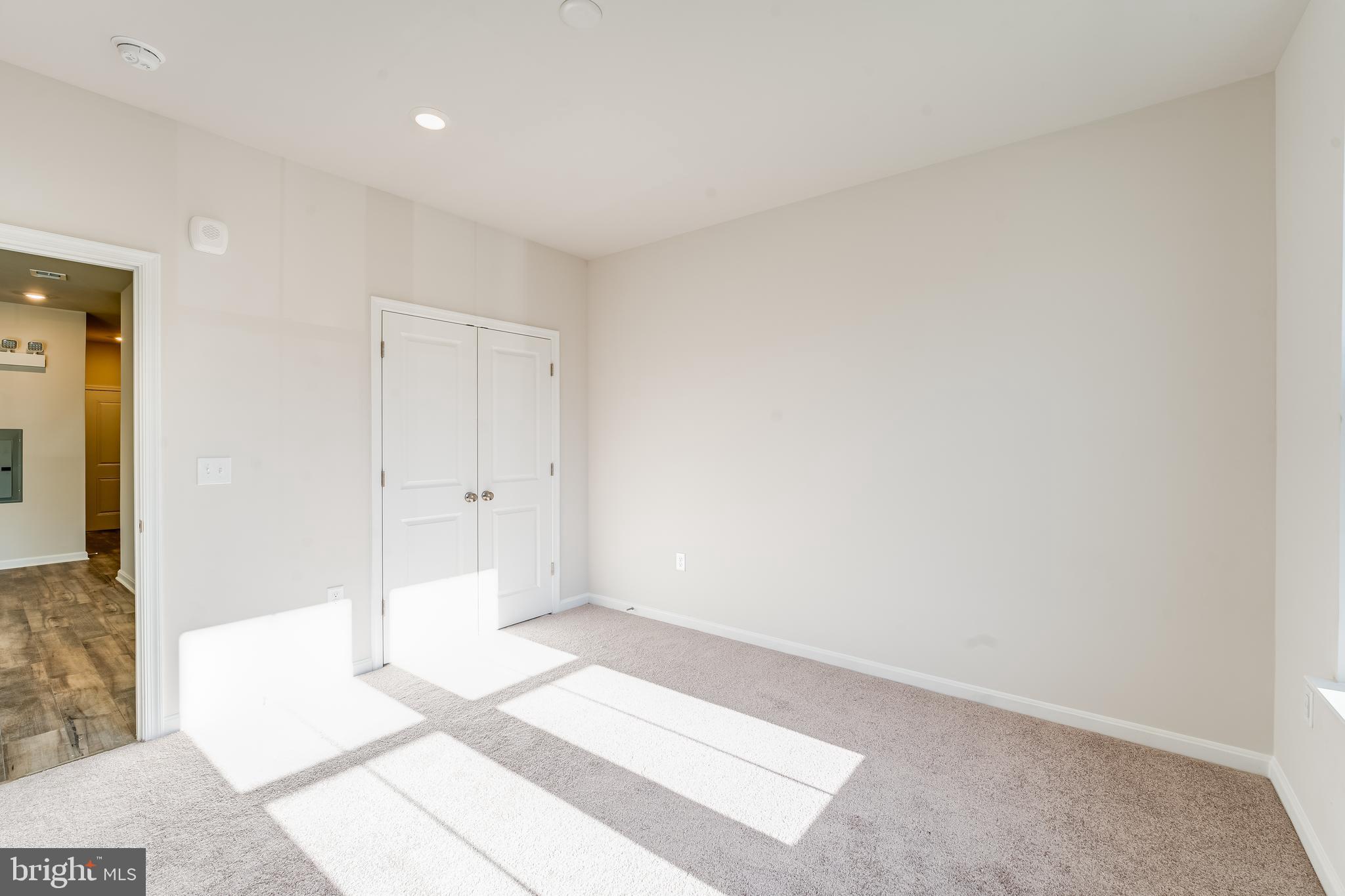 4003 Seaside Alder Road, Unit 102 ASTER Bowie, MD 20720 - Photo 12 of 16 a view of an empty room