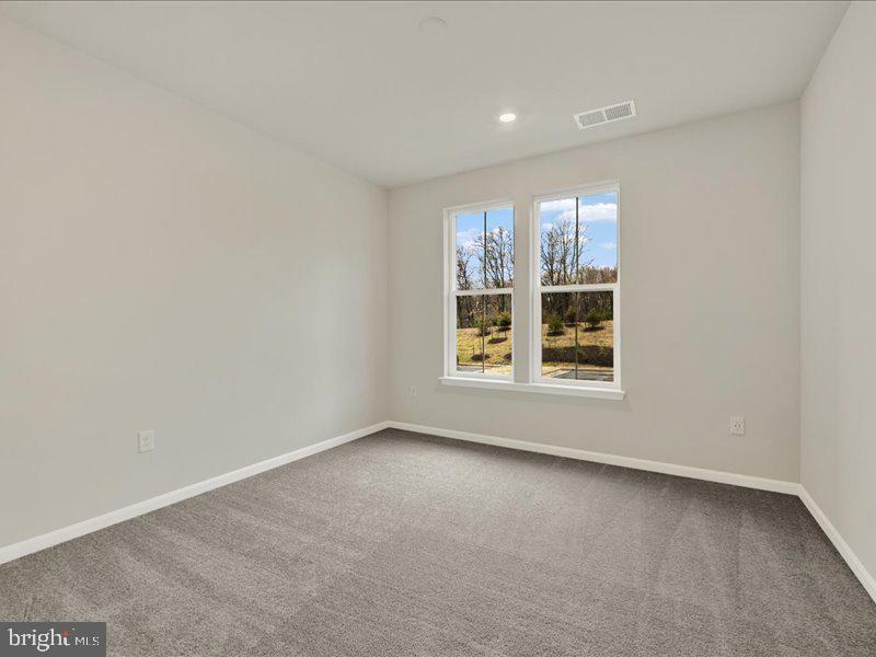 4003 Seaside Alder Road, Unit 102 ASTER Bowie, MD 20720 - Photo 22 of 27 an empty room with a window