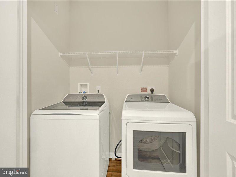4003 Seaside Alder Road, Unit 102 ASTER Bowie, MD 20720 - Photo 25 of 27 a utility room with dryer and washer