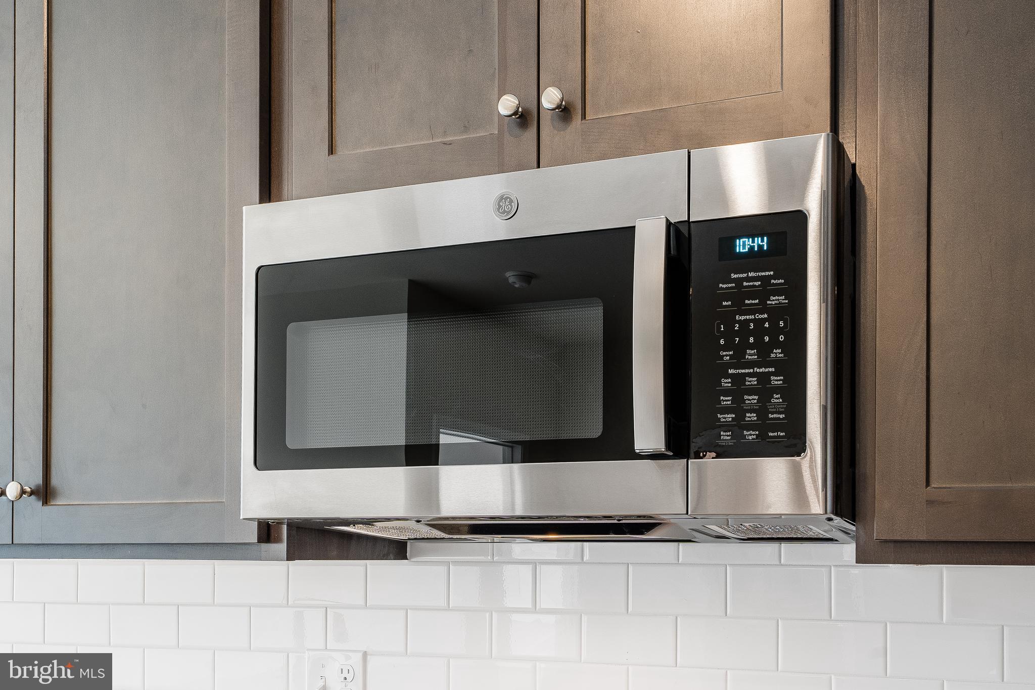4003 Seaside Alder Road, Unit 102 ASTER Bowie, MD 20720 - Photo 6 of 16 a bathroom with a sink and a mirror