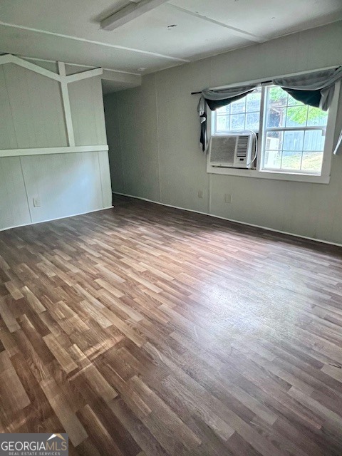 3195 Henderson Grove Road Sandersville, GA 31082 - Photo 31 of 50 an empty room with wooden floor and windows