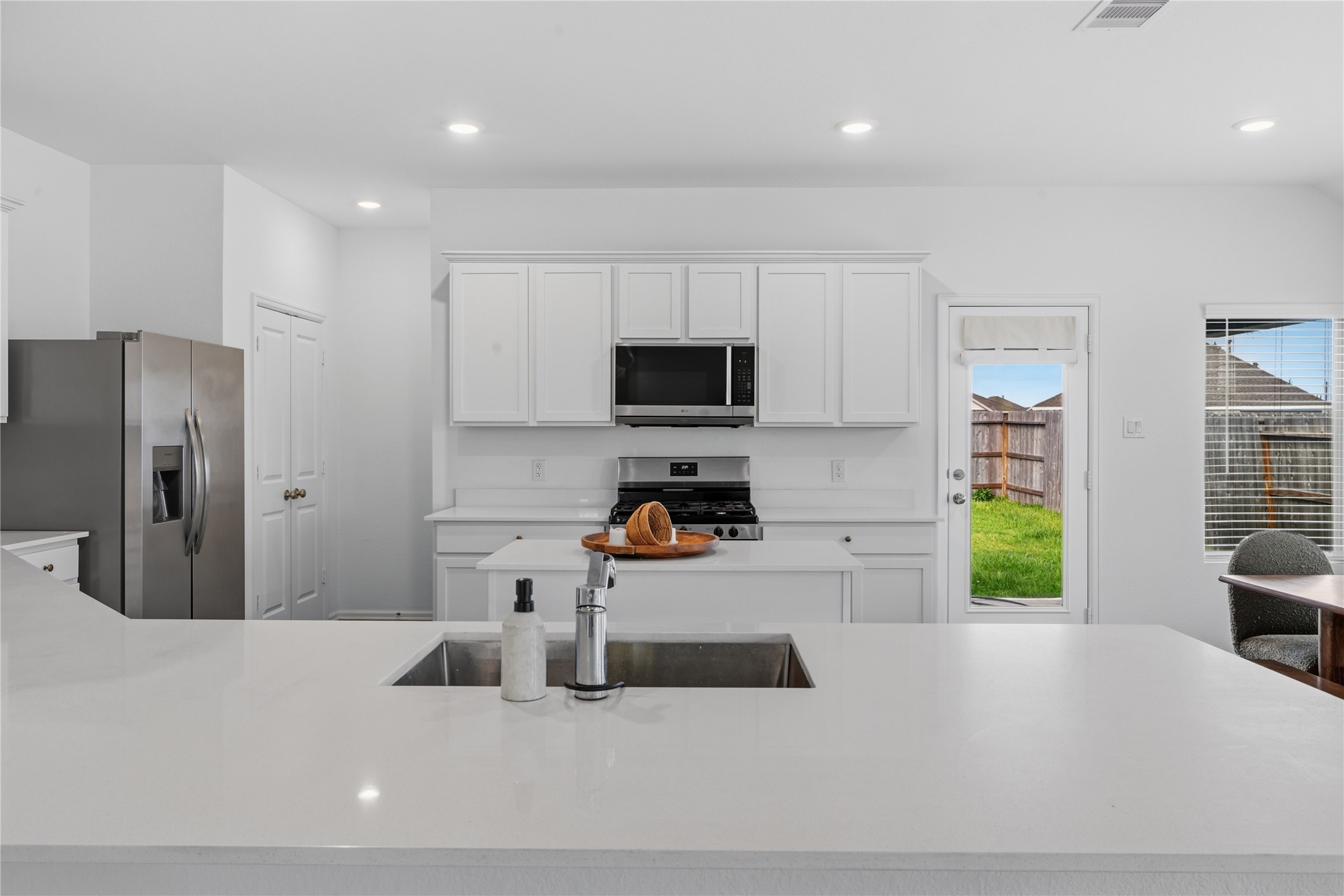 9906 Keystone Meadow Place Baytown, TX 77521 - Photo 9 of 42 Large pantry to your left. Clean modern kitchen