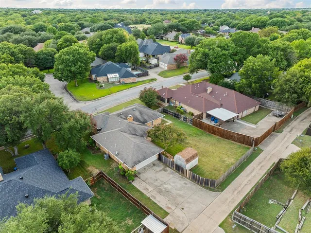 an aerial view of a house with a swimming pool yard and outdoor seating
