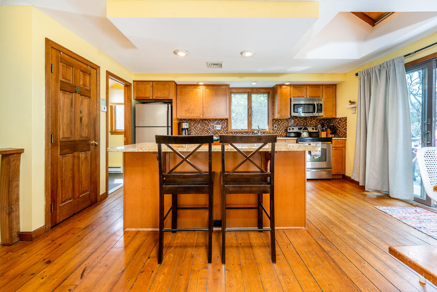 150 Herring Brook Road Eastham, MA 02642 - Photo 11 of 54 a view of a livingroom with furniture window and wooden floor