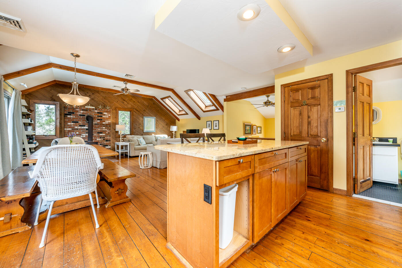 150 Herring Brook Road Eastham, MA 02642 - Photo 15 of 54 a kitchen with stainless steel appliances granite countertop a sink and wooden cabinets