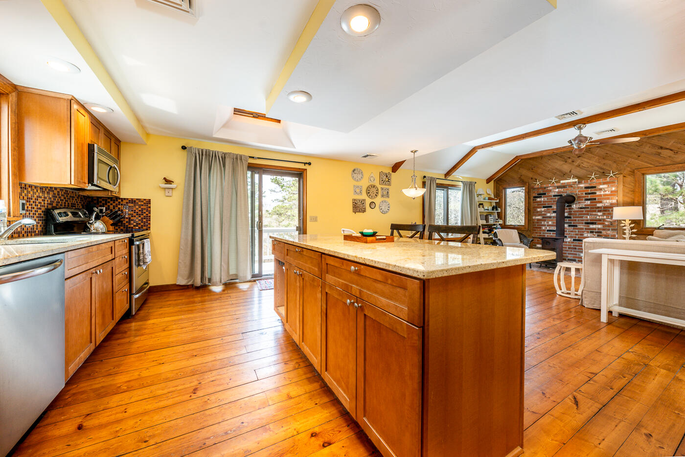 150 Herring Brook Road Eastham, MA 02642 - Photo 16 of 54 a kitchen with stainless steel appliances granite countertop a stove and a sink