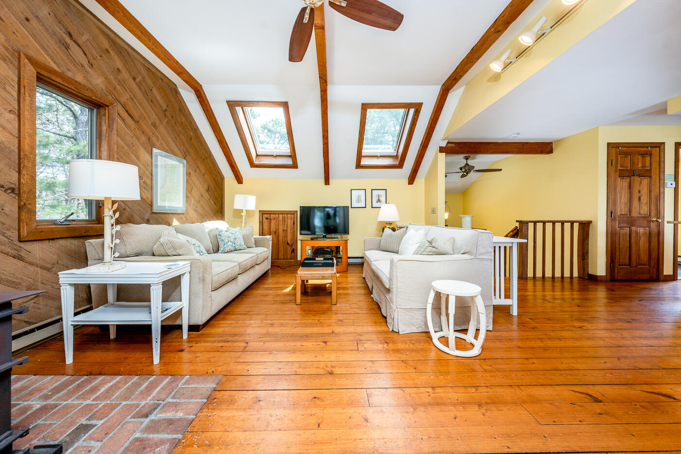 150 Herring Brook Road Eastham, MA 02642 - Photo 17 of 54 a living room with furniture and a wooden floor