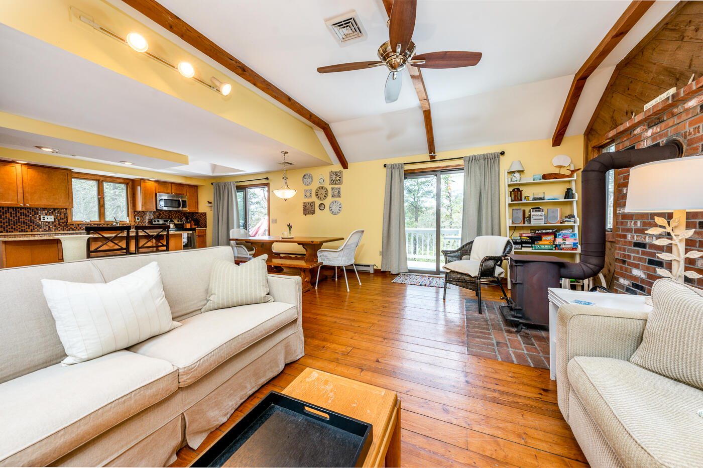 150 Herring Brook Road Eastham, MA 02642 - Photo 20 of 54 a living room with furniture fireplace and a large window