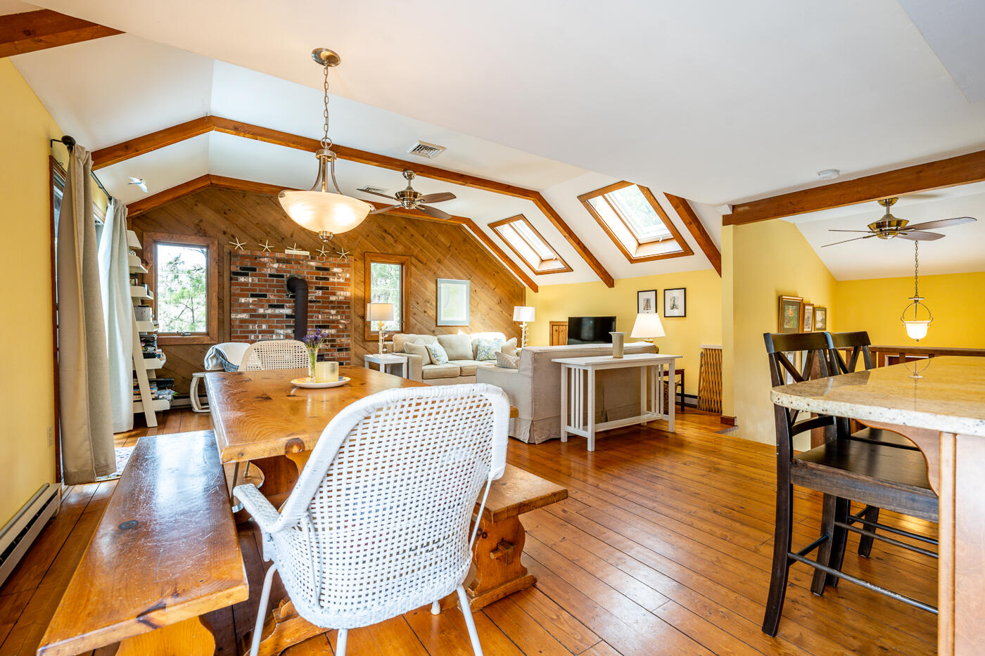 150 Herring Brook Road Eastham, MA 02642 - Photo 27 of 54 a view of a dining room with furniture and wooden floor