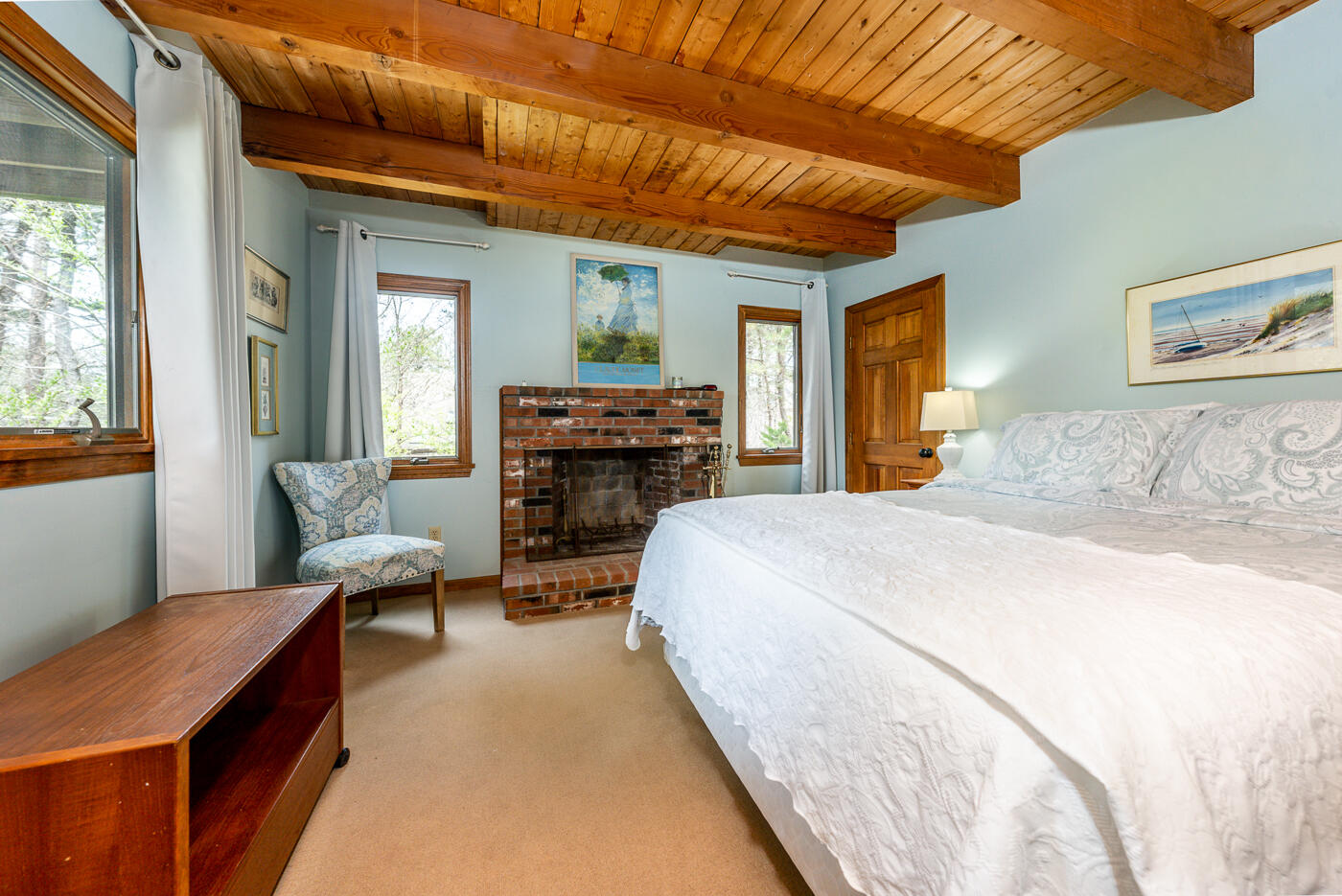 150 Herring Brook Road Eastham, MA 02642 - Photo 31 of 54 a bedroom with a bed and wooden floor