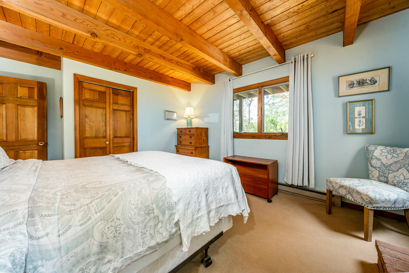 150 Herring Brook Road Eastham, MA 02642 - Photo 32 of 54 a bedroom with a bed and wooden floor