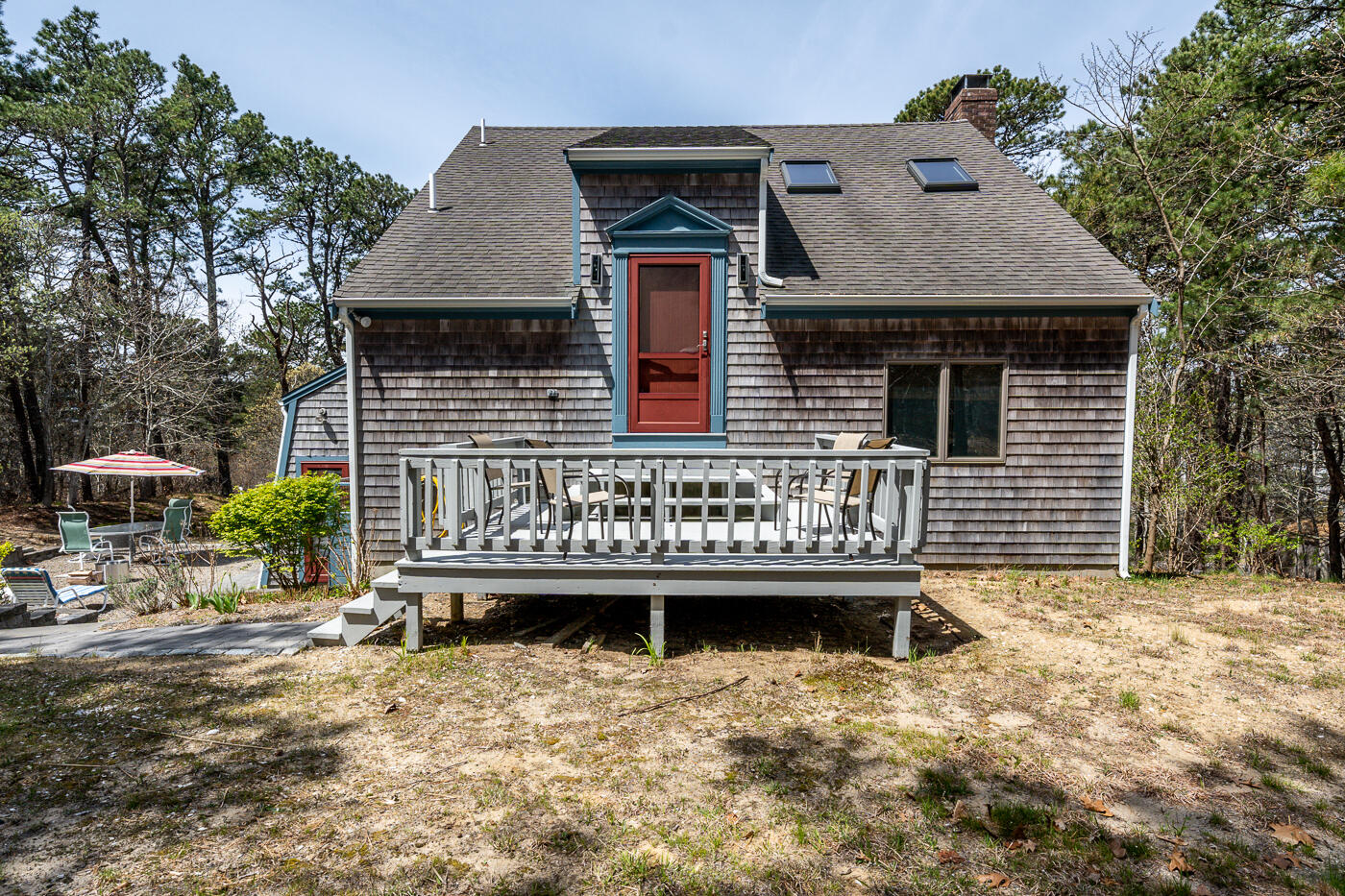150 Herring Brook Road Eastham, MA 02642 - Photo 37 of 54 a front view of a house with a yard and garage