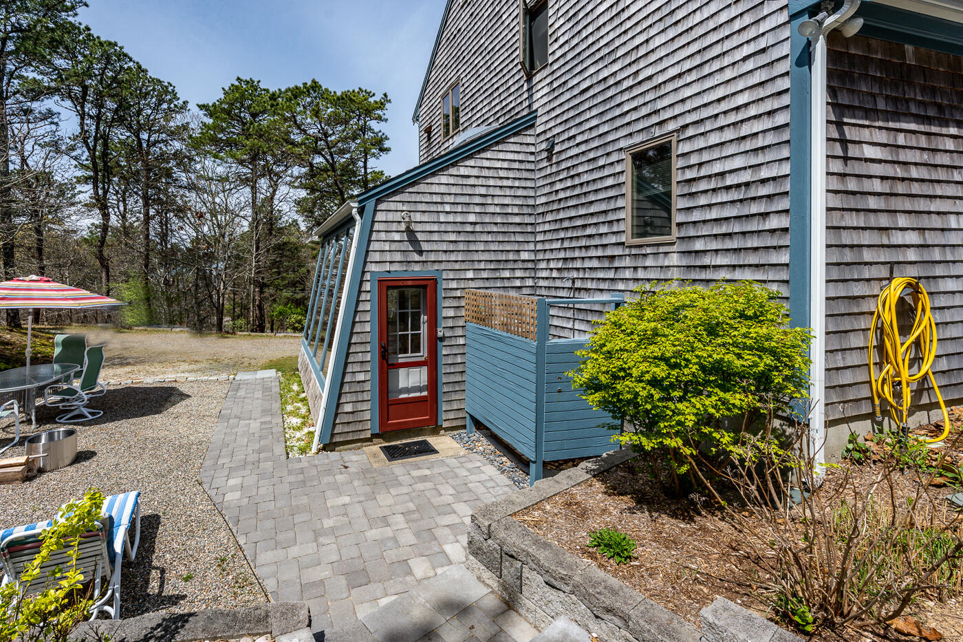 150 Herring Brook Road Eastham, MA 02642 - Photo 40 of 54 a view of a house with backyard and sitting area