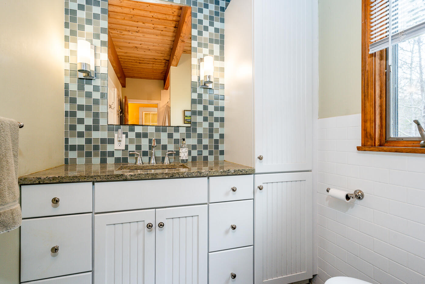 150 Herring Brook Road Eastham, MA 02642 - Photo 41 of 54 a bathroom with a sink and mirror with shower