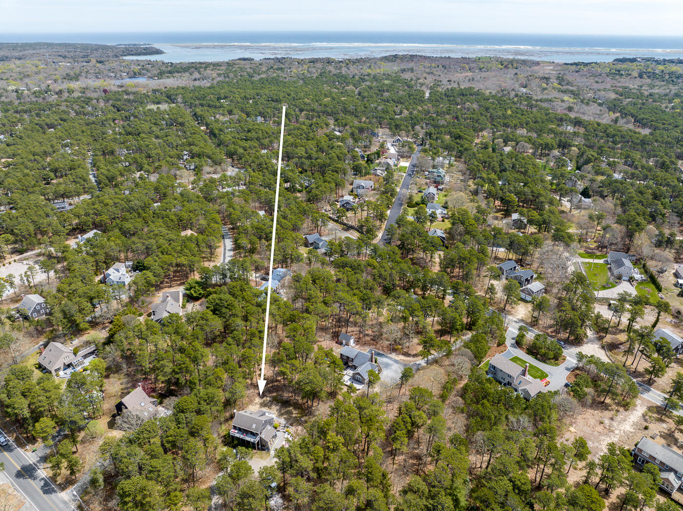 150 Herring Brook Road Eastham, MA 02642 - Photo 5 of 54 a view of a city with lush green forest