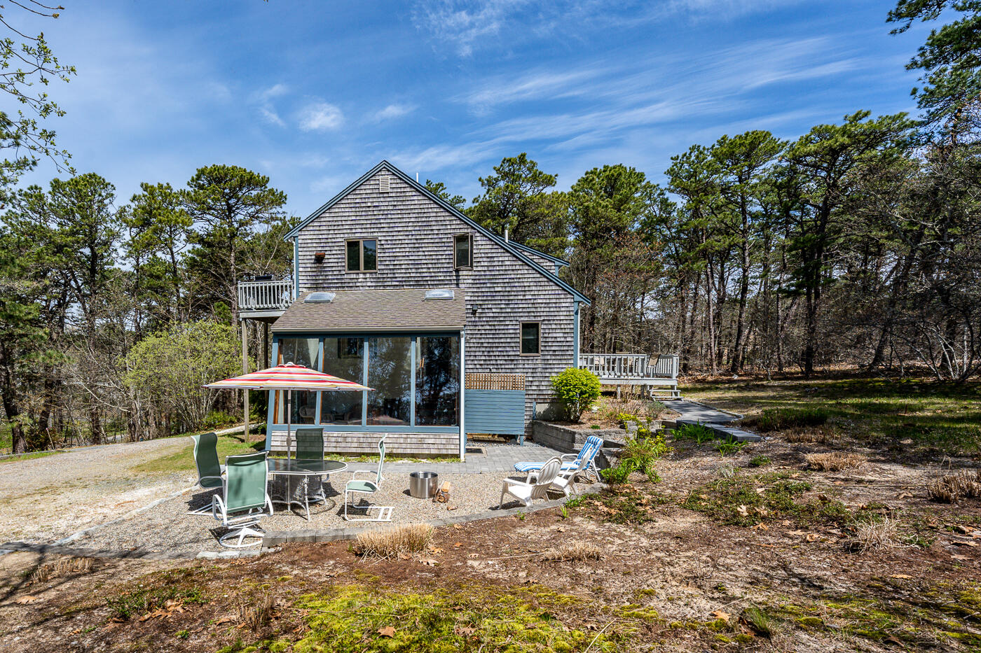 150 Herring Brook Road Eastham, MA 02642 - Photo 10 of 54 a front view of a house with garden