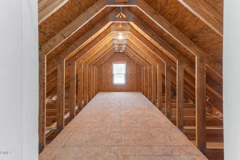 a view of a livingroom with wooden floor and window