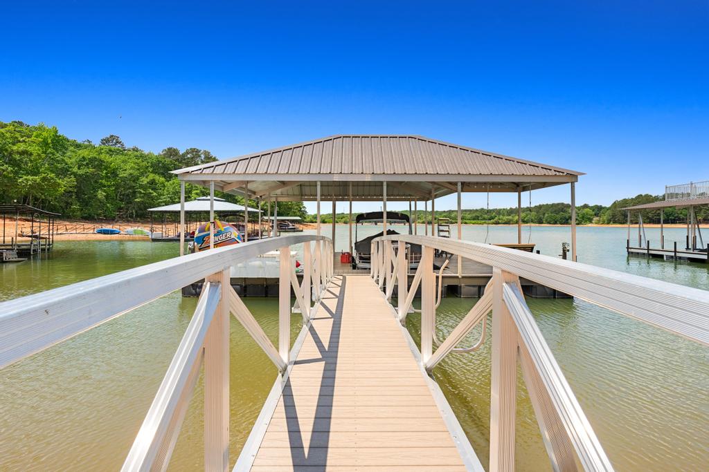 707 Vickery Street Extension Hartwell, GA 30643 - Photo 46 of 50 Boasting direct lake access with a private covered boat dock, perfect for water adventures.