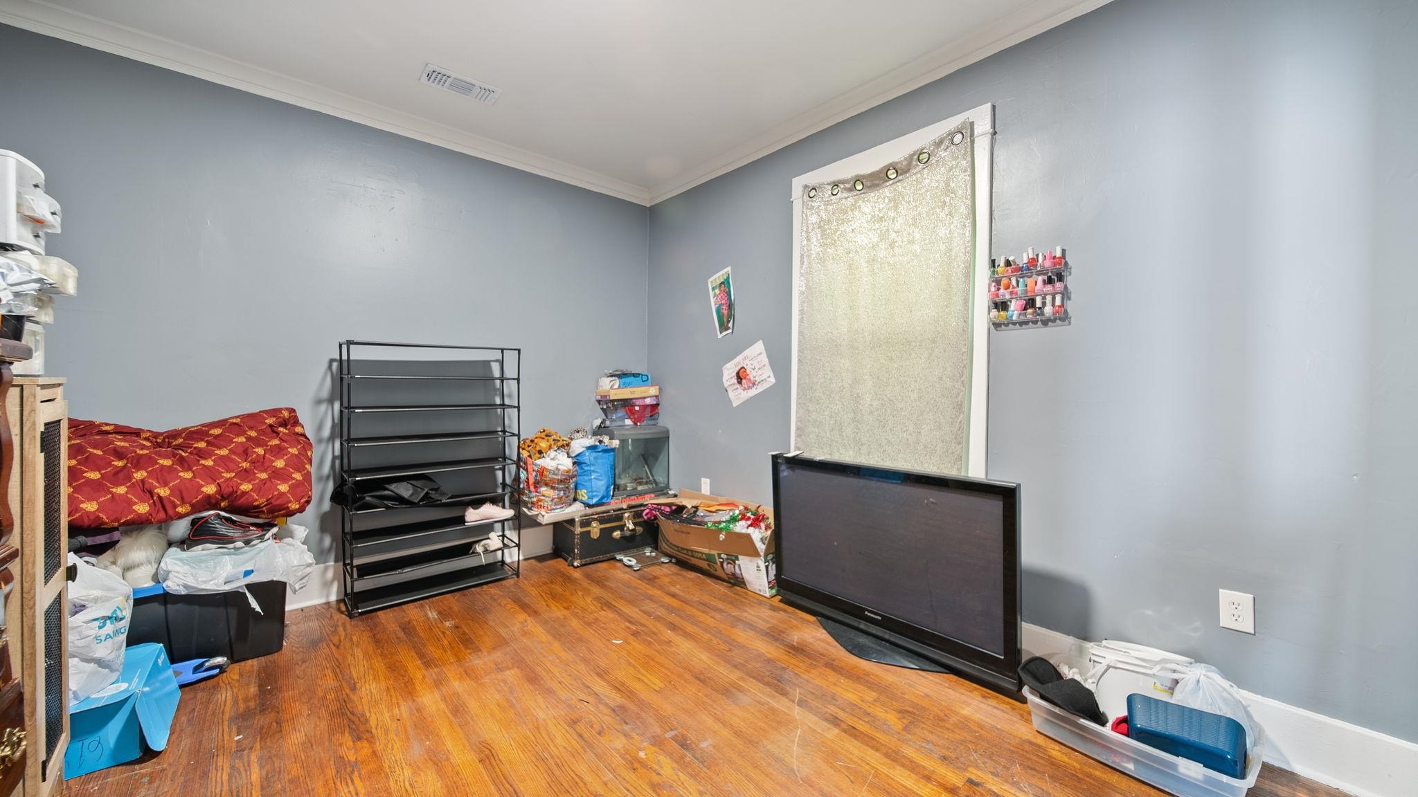 659 Decatur Street Memphis, TN 38107 - Photo 21 of 24 Interior room featuring wood-finish flooring and light blue walls
