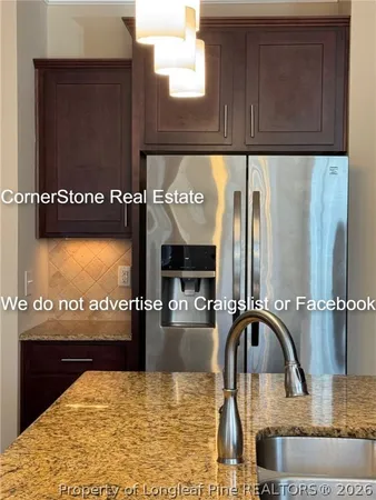 a kitchen with appliances and cabinets