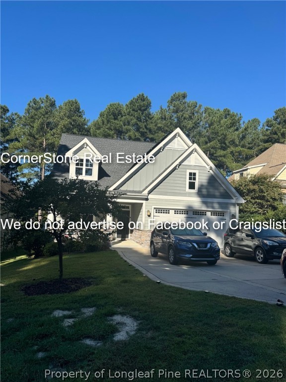 547 Micahs Way North Spring Lake, NC 28390 - Photo 2 of 28 a front view of a house with garden