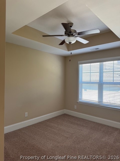 547 Micahs Way North Spring Lake, NC 28390 - Photo 27 of 28 en empty room with windows and ceiling fan