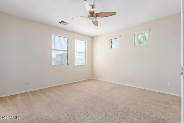 a view of a refrigerator in kitchen and wooden floor
