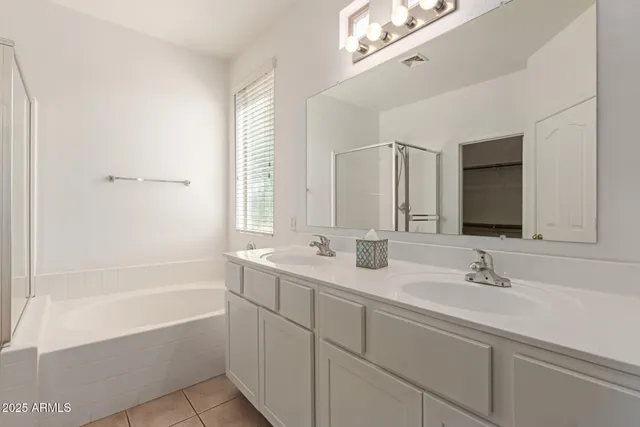 a bathroom with a sink a mirror and a toilet