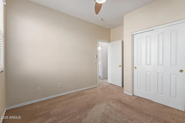 a bathroom with a tub a sink and mirror