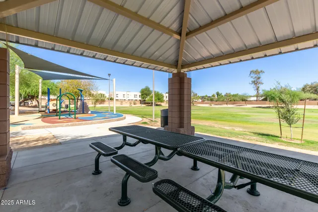 a view of a backyard with sitting area