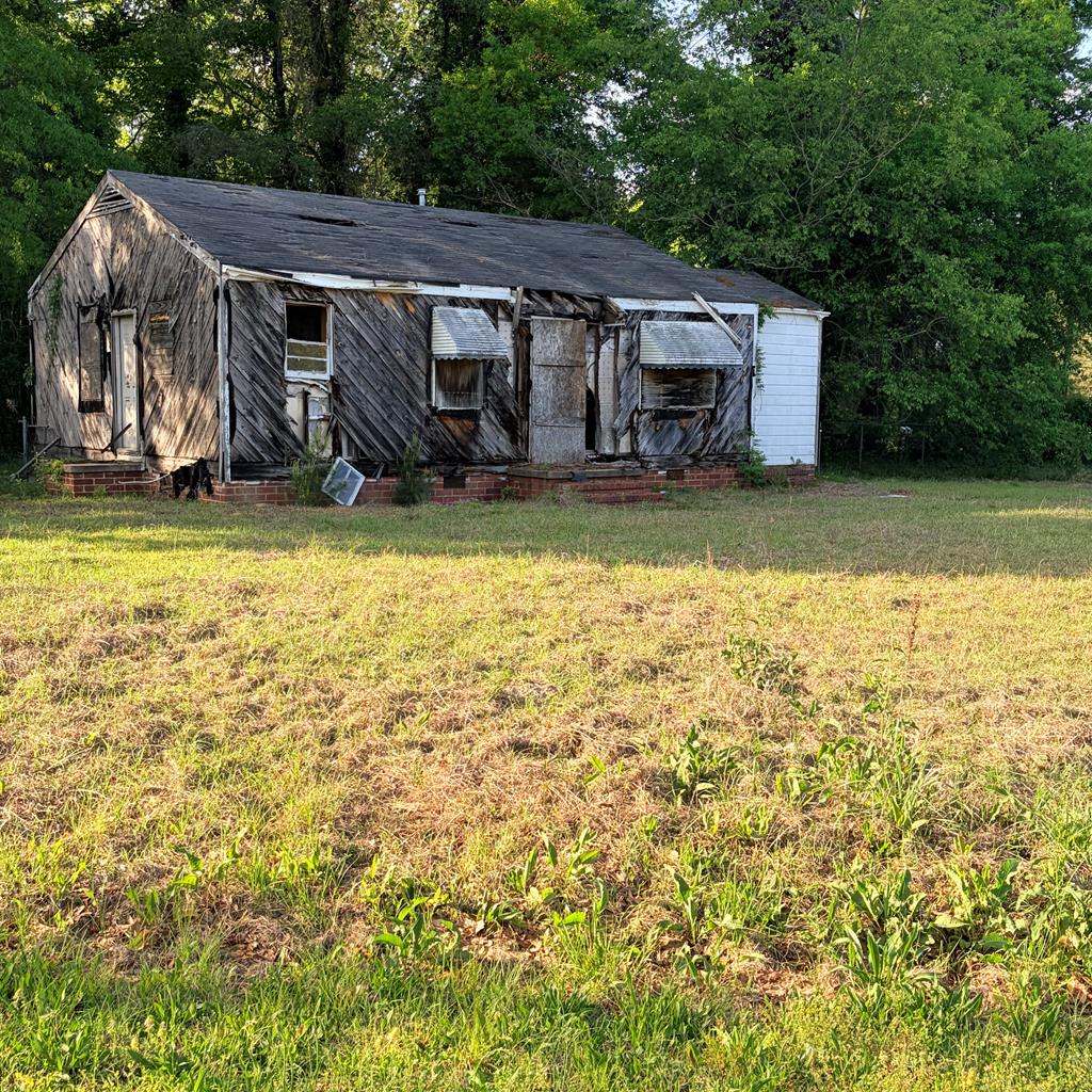 3135 Baker Circle Columbus, GA 31903 - Photo 4 of 7 an aerial view of a house with swimming pool and large trees