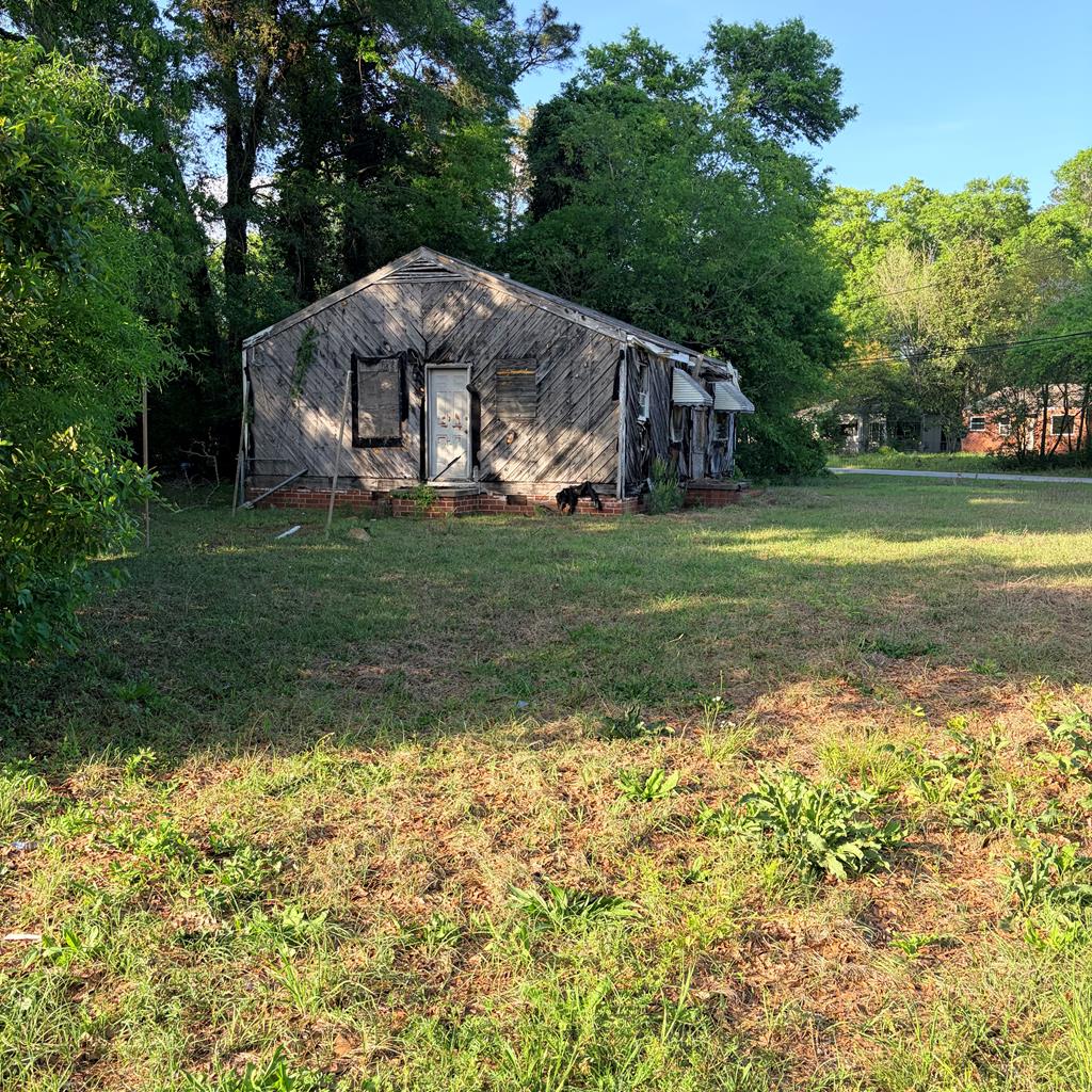 3135 Baker Circle Columbus, GA 31903 - Photo 6 of 7 a view of a house with a yard and sitting area
