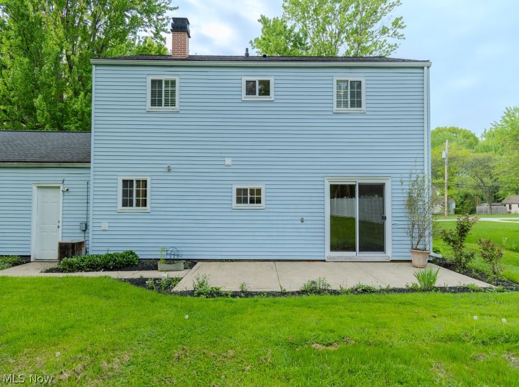 8828 Edgehill Road Mentor, OH 44060 - Photo 22 of 24 Rear view of property with a patio area and a yard