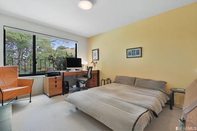 a bedroom with a bed and furniture