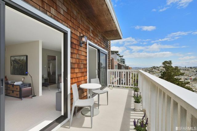 a view of balcony with furniture