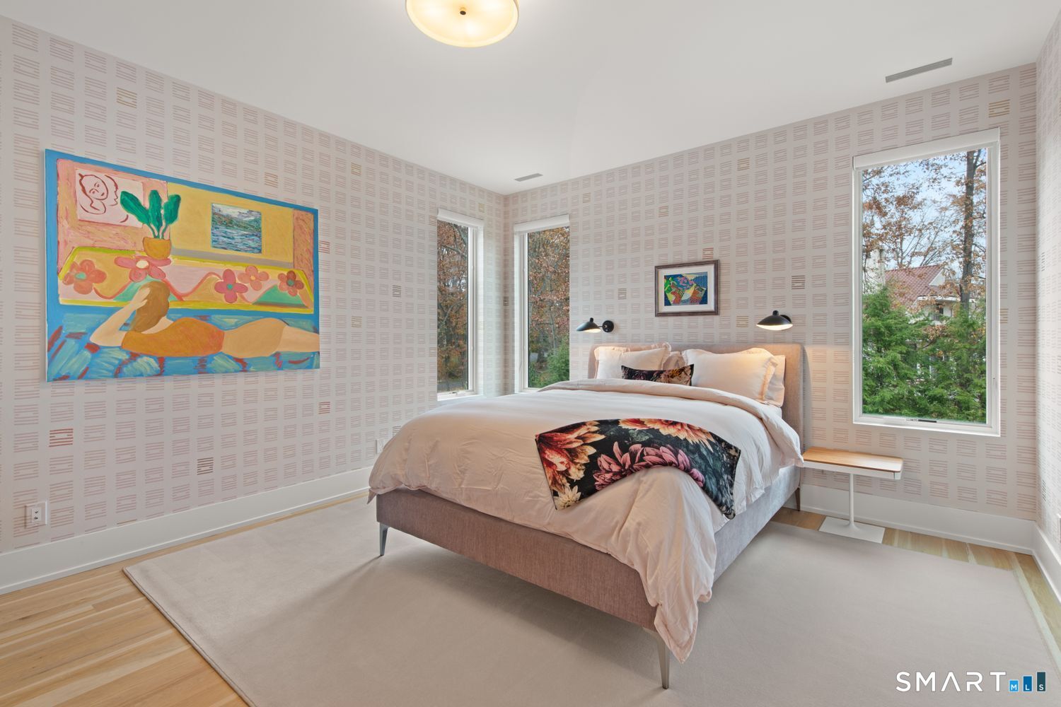 19 Beachside Common Westport, CT 06880 - Photo 22 of 40 a bedroom with a bed and a painting on the wall