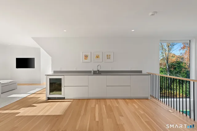 a view of a living room with a flat screen tv